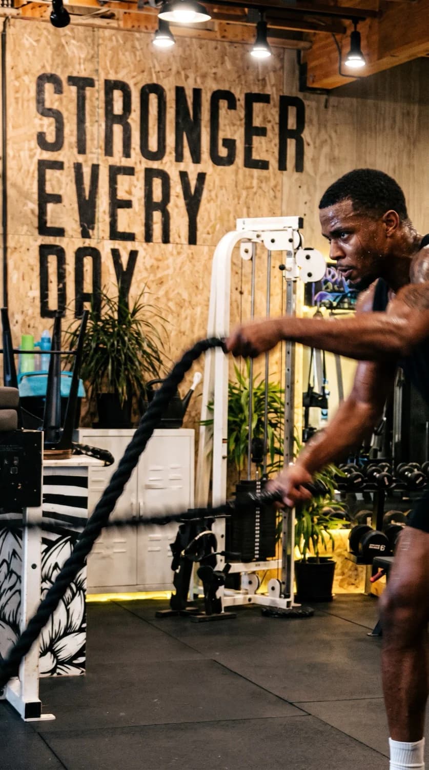 A member training under coaching at Leaner Fitness